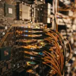 An intricate, high-end server component featuring many interconnected, subtly glowing ports and pathways